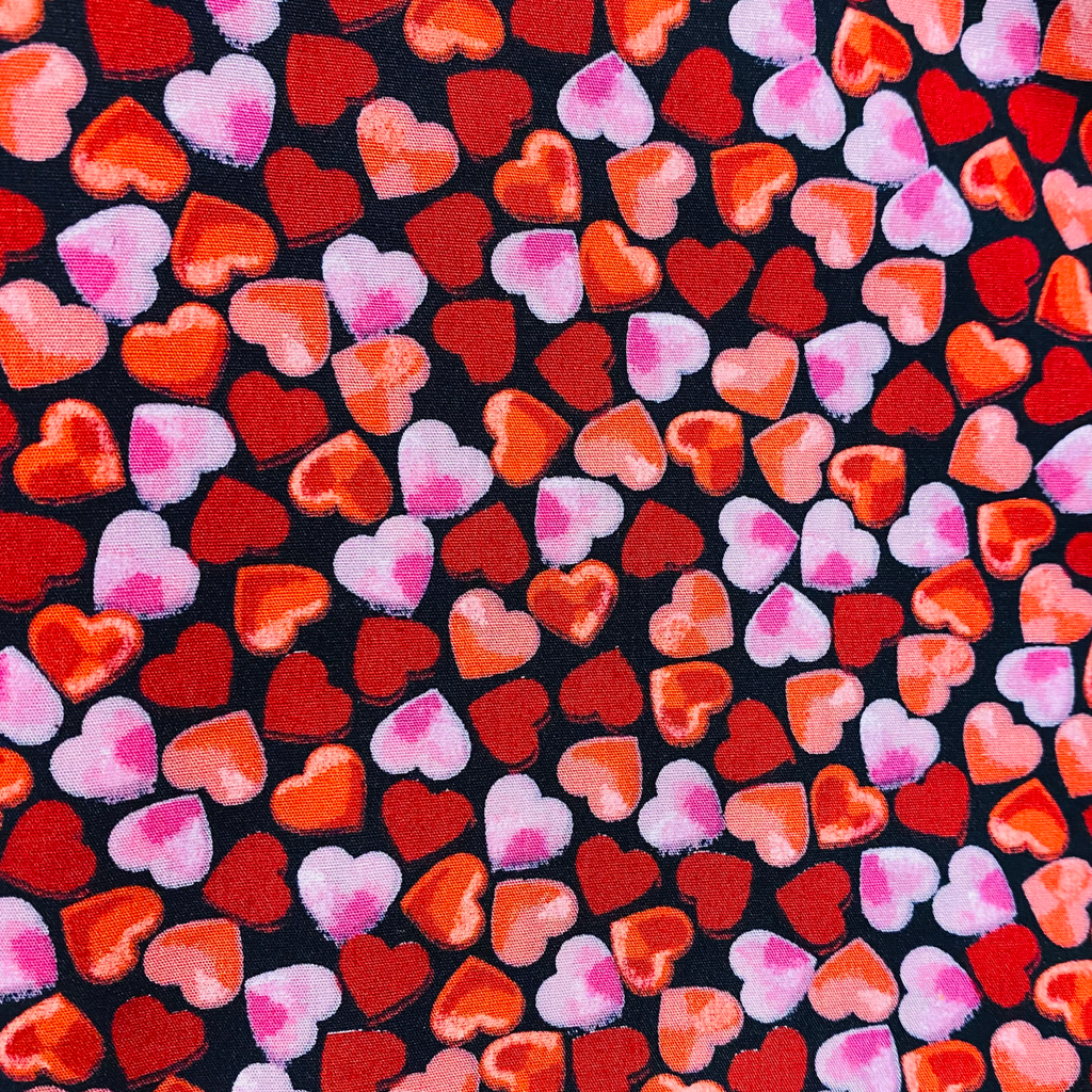 Pink and Red Ombre Hearts on a Black Background Cotton Fabric